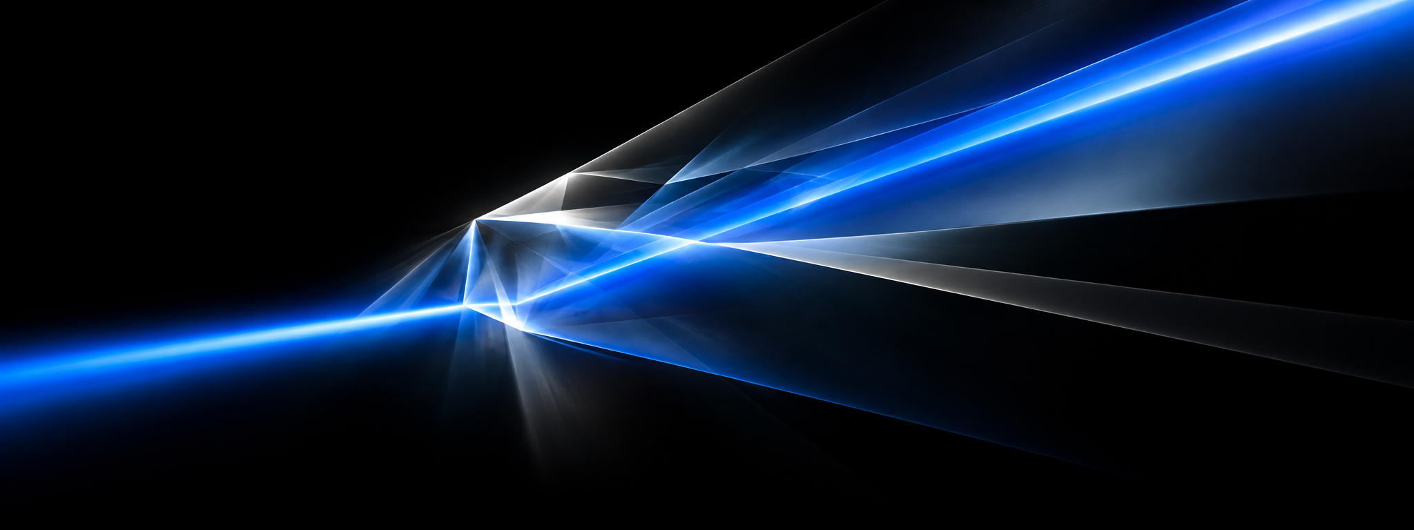 The beam on black: a single band of blue light entering a glass edge and fanning into facets